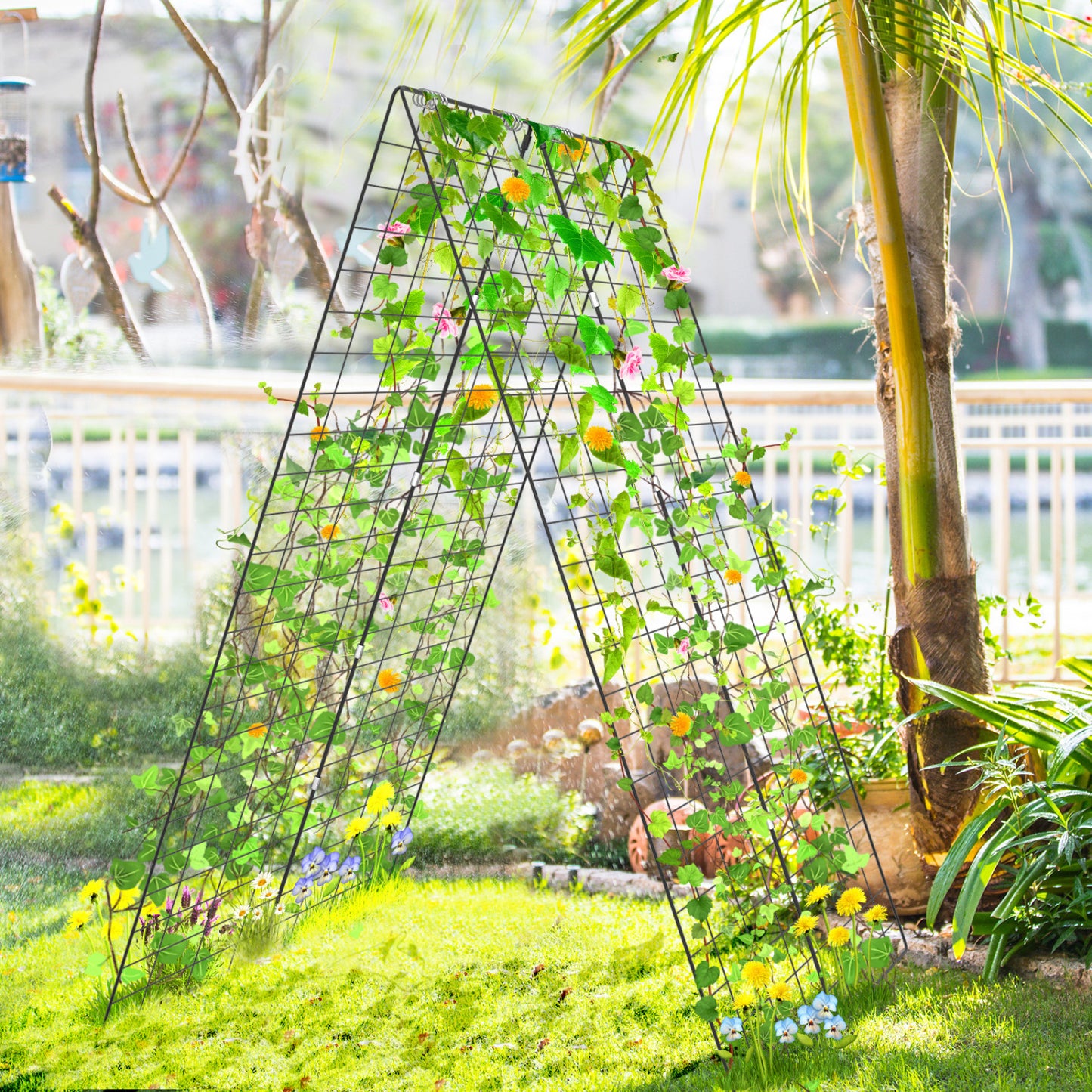 Green A-frame garden trellis with ground stake and cable ties for supporting climbing plants in outdoor gardens.