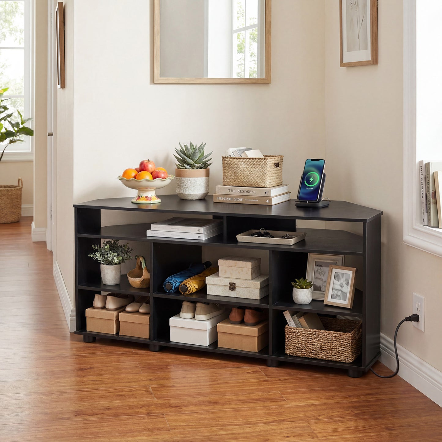 Black corner entertainment center for TVs up to 55 inches, modern TV stand for living room, by Wilsons Home Store.