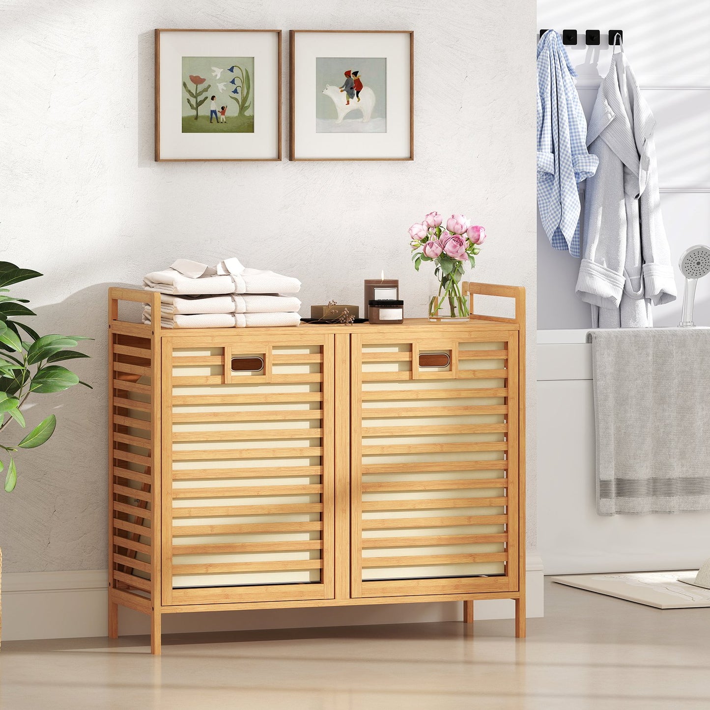 Double tilt-out laundry hamper with two removable bins in natural finish, perfect for organizing laundry in bathroom or utility space.