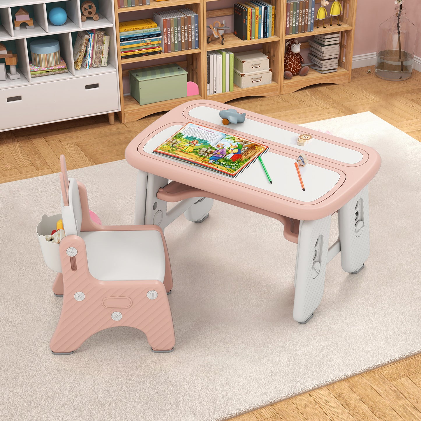 Pink kids table and chair set with a flip-top bookshelf, suitable for toddlers and young children, by Wilsons Home Store.