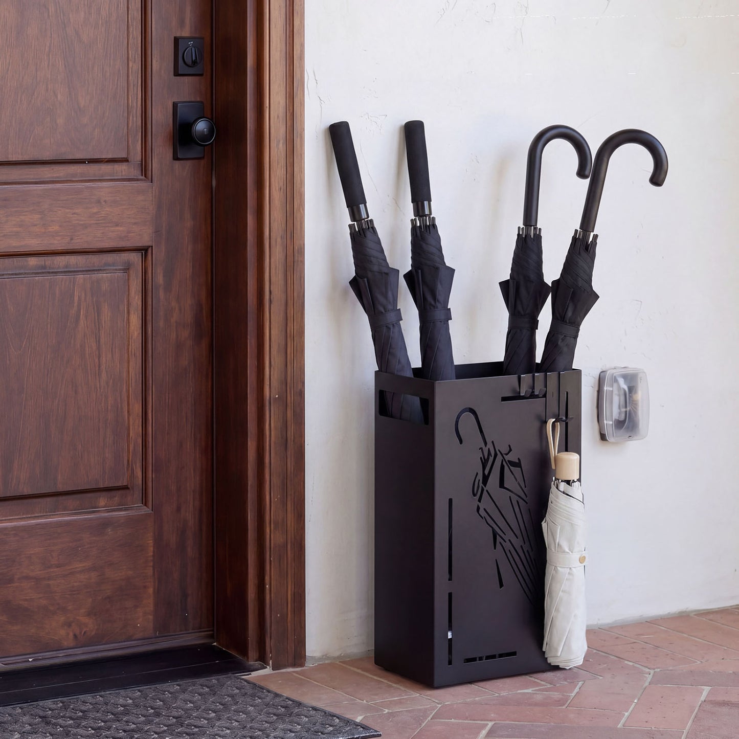 Black rectangular umbrella holder rack with removable drip tray, designed for entryway shoe storage and organization.
