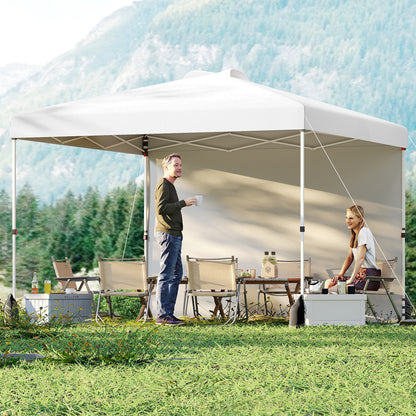 White 10x10 ft pop-up canopy tent with one sidewall and wheeled bag, ideal for outdoor shade and event coverage.