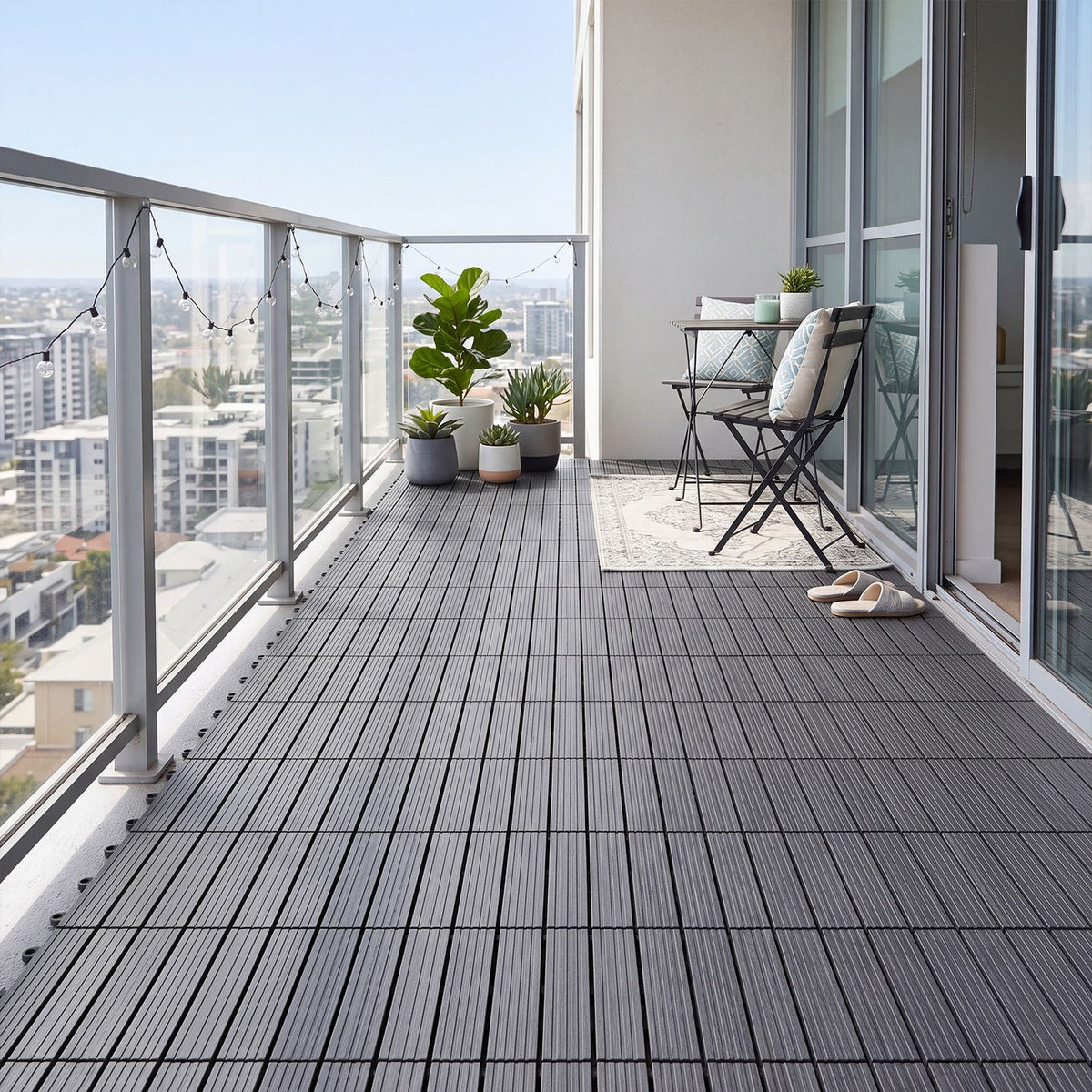 Pair of 12x12-inch gray waterproof PP plastic interlocking deck tiles for outdoor patios, shown assembled on a patio surface.