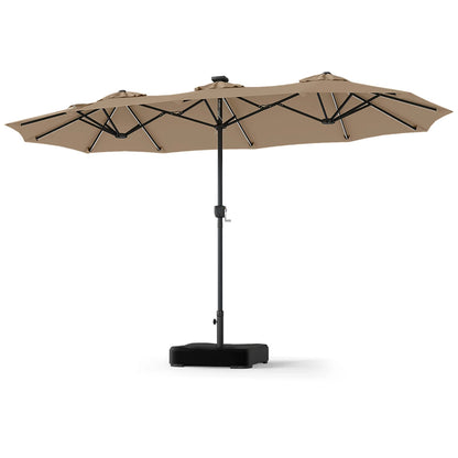 Beige 13 ft double-sided patio umbrella with 108 LED lights and included base, perfect for outdoor shading and decor.
