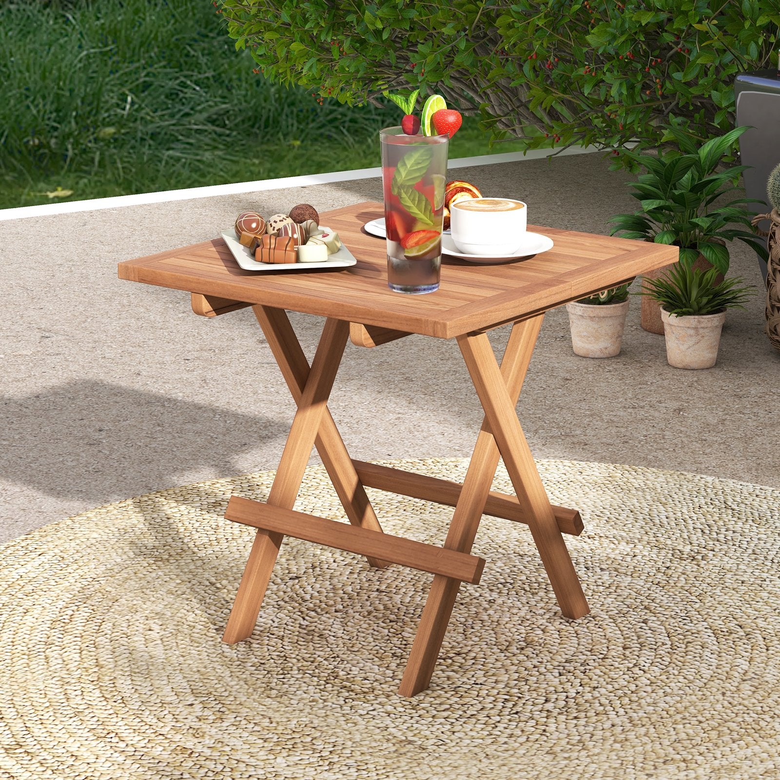 Square teak wood patio folding table with slatted tabletop, portable outdoor table for picnics and outdoor gatherings.