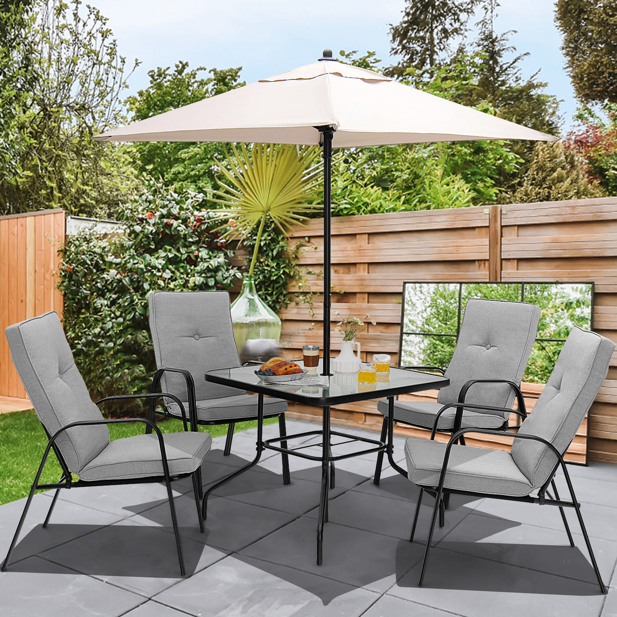 Six-piece patio dining set with umbrella and stackable cushioned chairs, outdoor furniture by Wilsons Home Store.