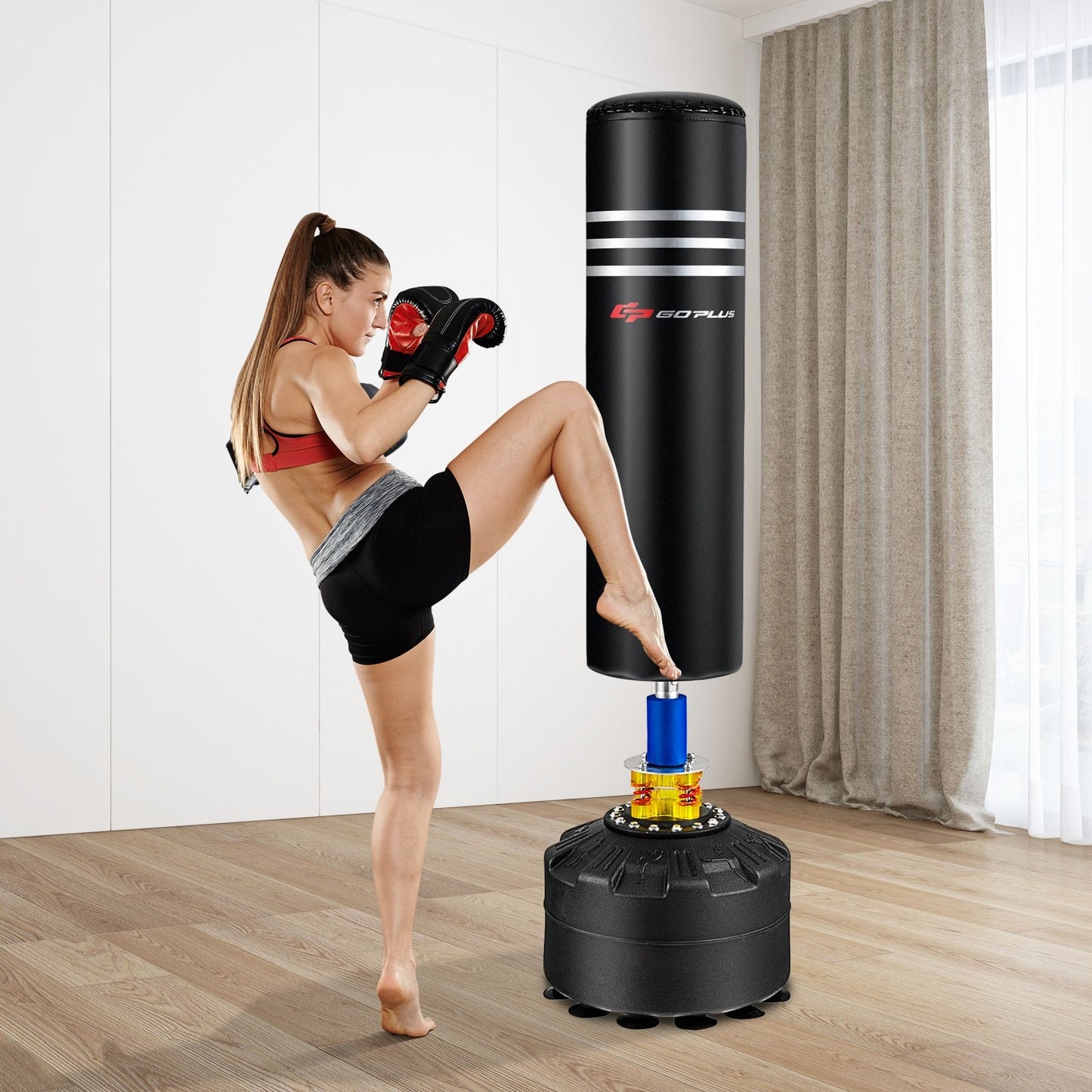 70-inch freestanding boxing punching bag with 12 suction cup base, suitable for strength training and martial arts workouts.