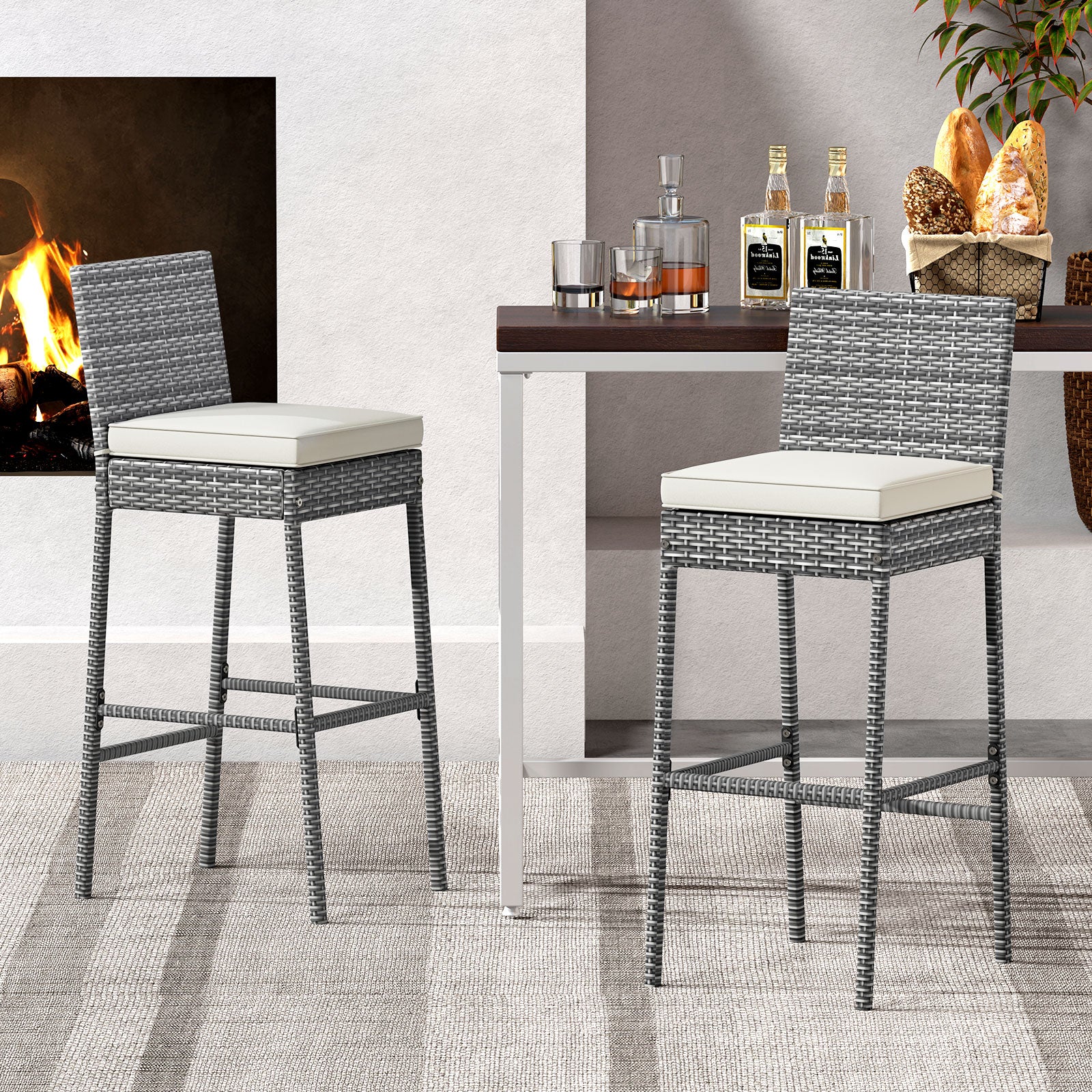 Set of 2 outdoor wicker patio barstools with soft cushions and cozy footrests, perfect for outdoor patio furniture.