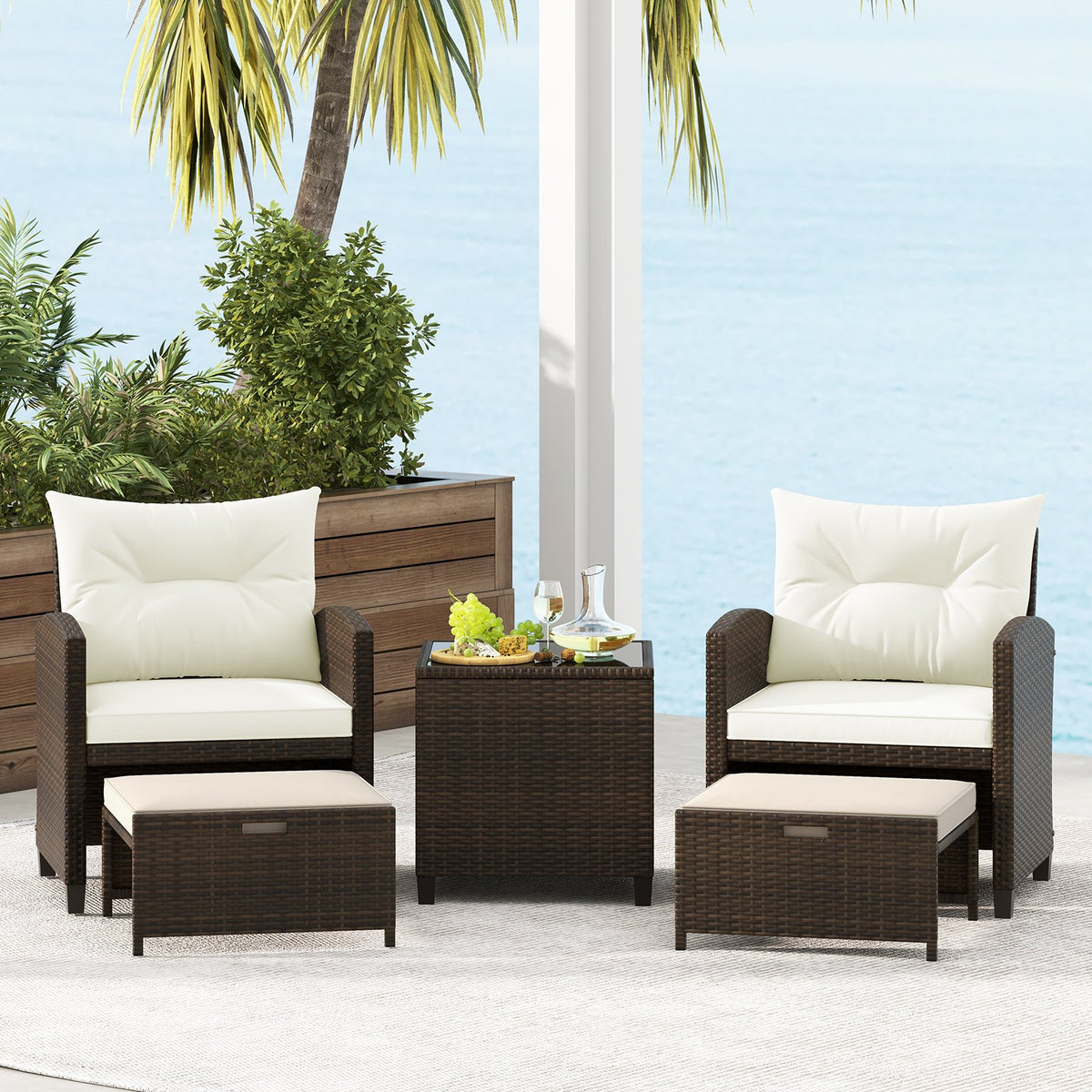 Beige 5-piece patio rattan furniture set with 2 ottomans and glass coffee table, outdoor conversation furniture.