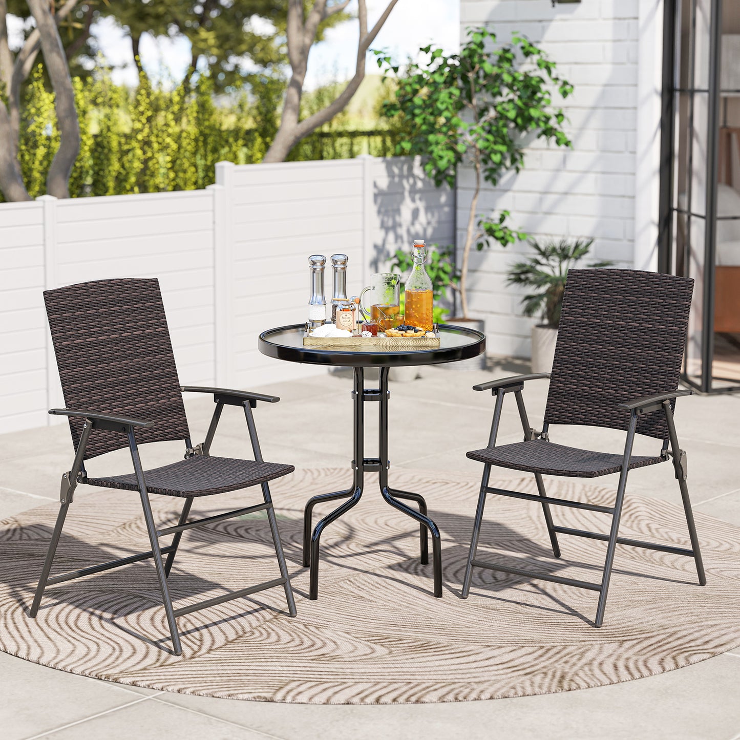 Pair of patio PE wicker dining chairs with armrests and metal frames, outdoor seating set for patio dining.