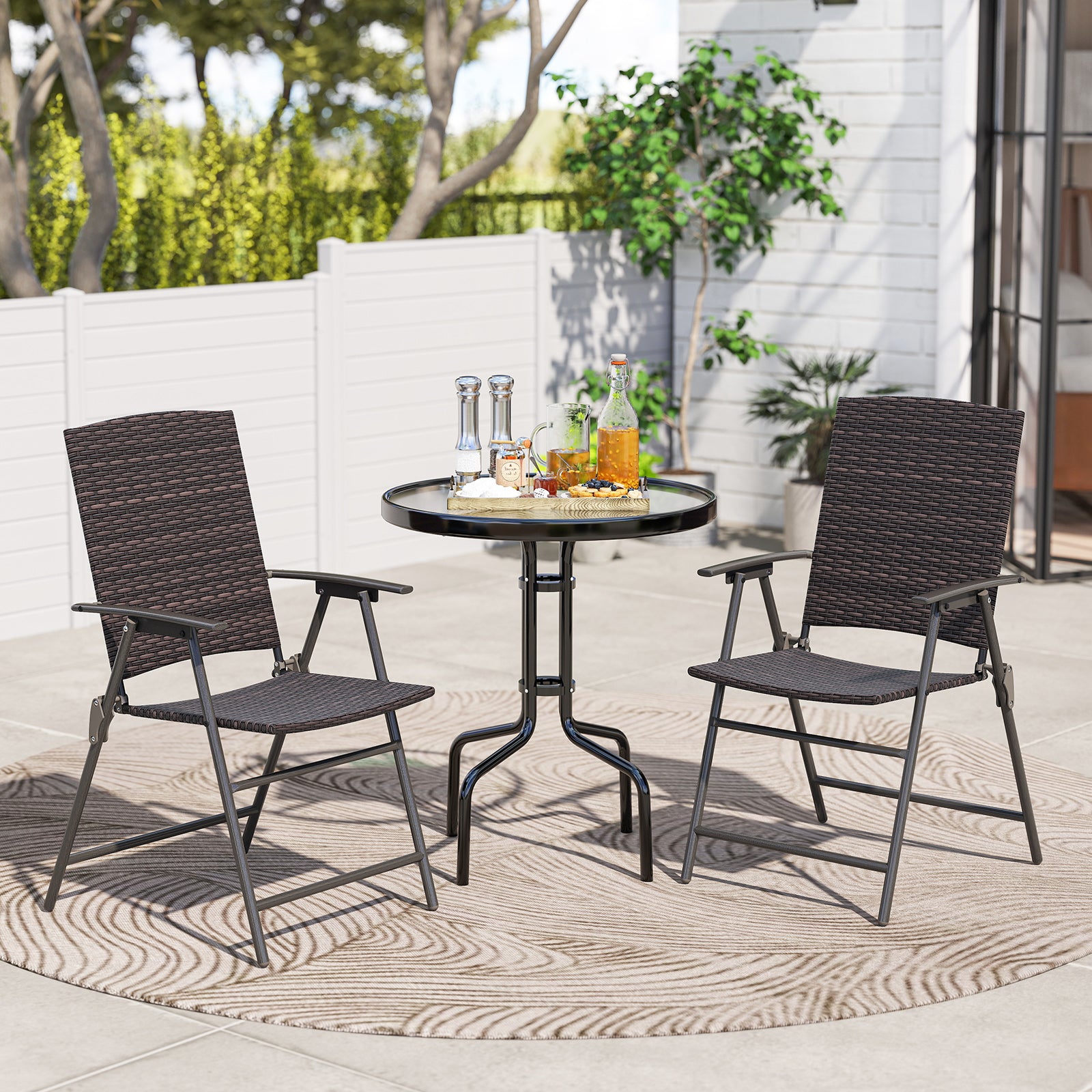 Pair of patio PE wicker dining chairs with armrests and metal frames, outdoor seating set for patio dining.