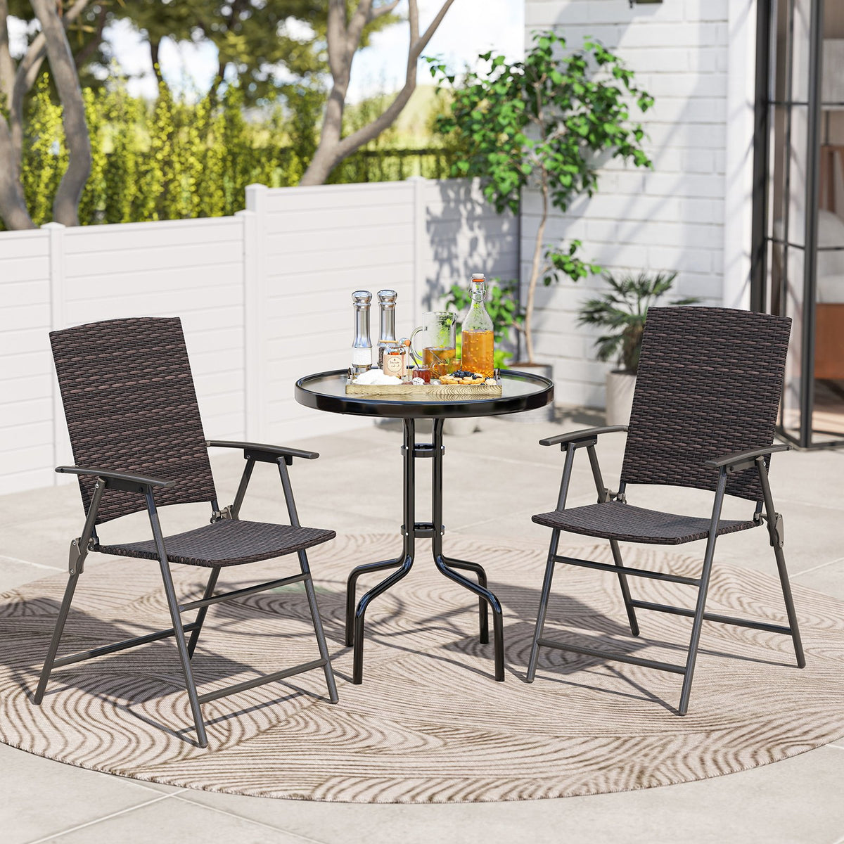 Set of four outdoor patio PE wicker dining chairs with armrests and metal frames, designed for comfortable outdoor dining.