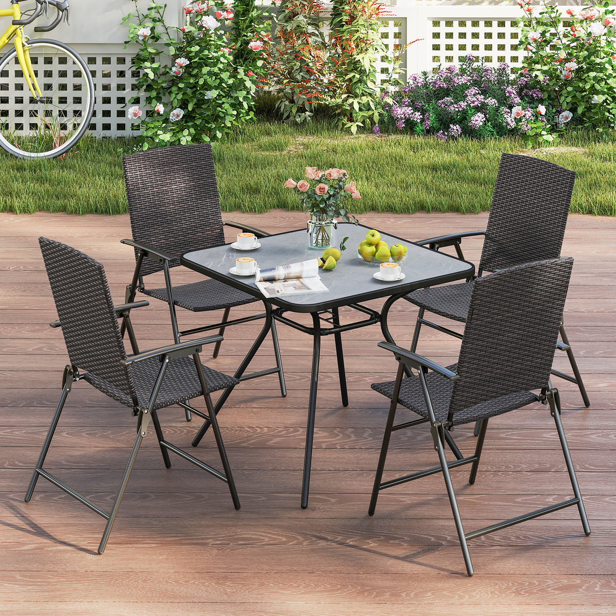 Set of four patio PE wicker dining chairs with armrests and metal frames, outdoor seating by Wilsons Home Store.