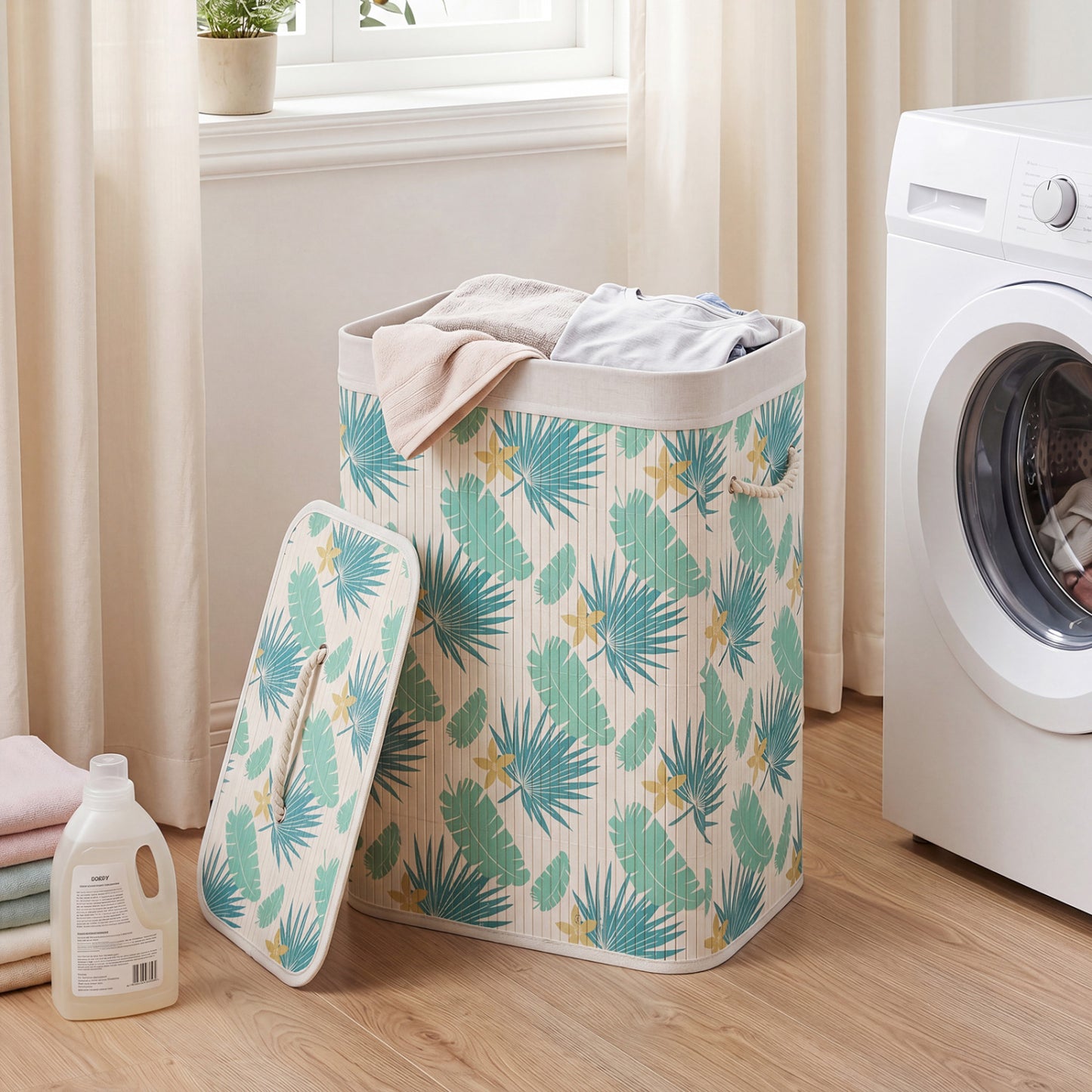 Green 19-gallon bamboo laundry hamper with removable liner and portable handles, ideal for bathroom organization.