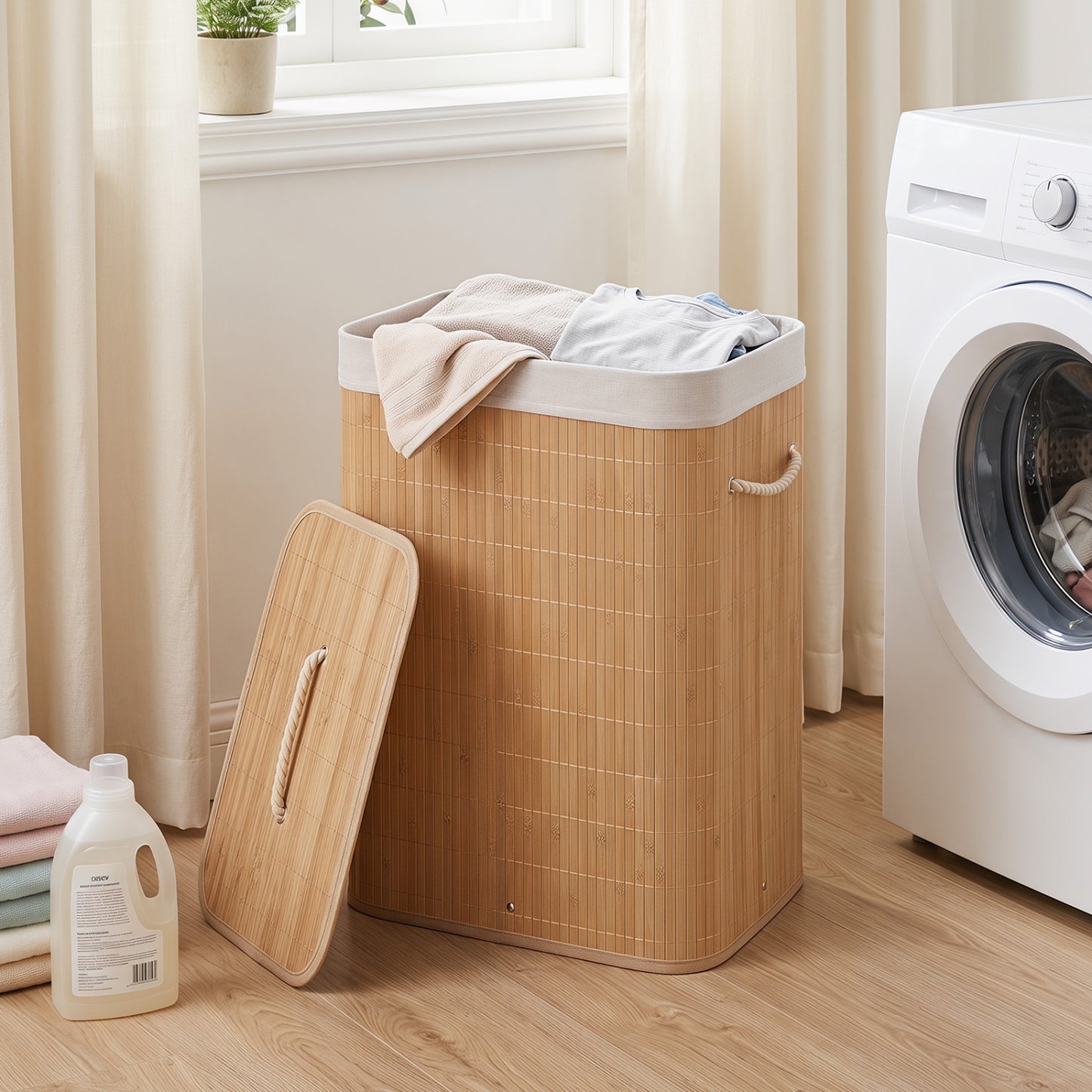 Green 19-gallon bamboo laundry hamper with removable liner and portable handles, ideal for bath and laundry rooms.