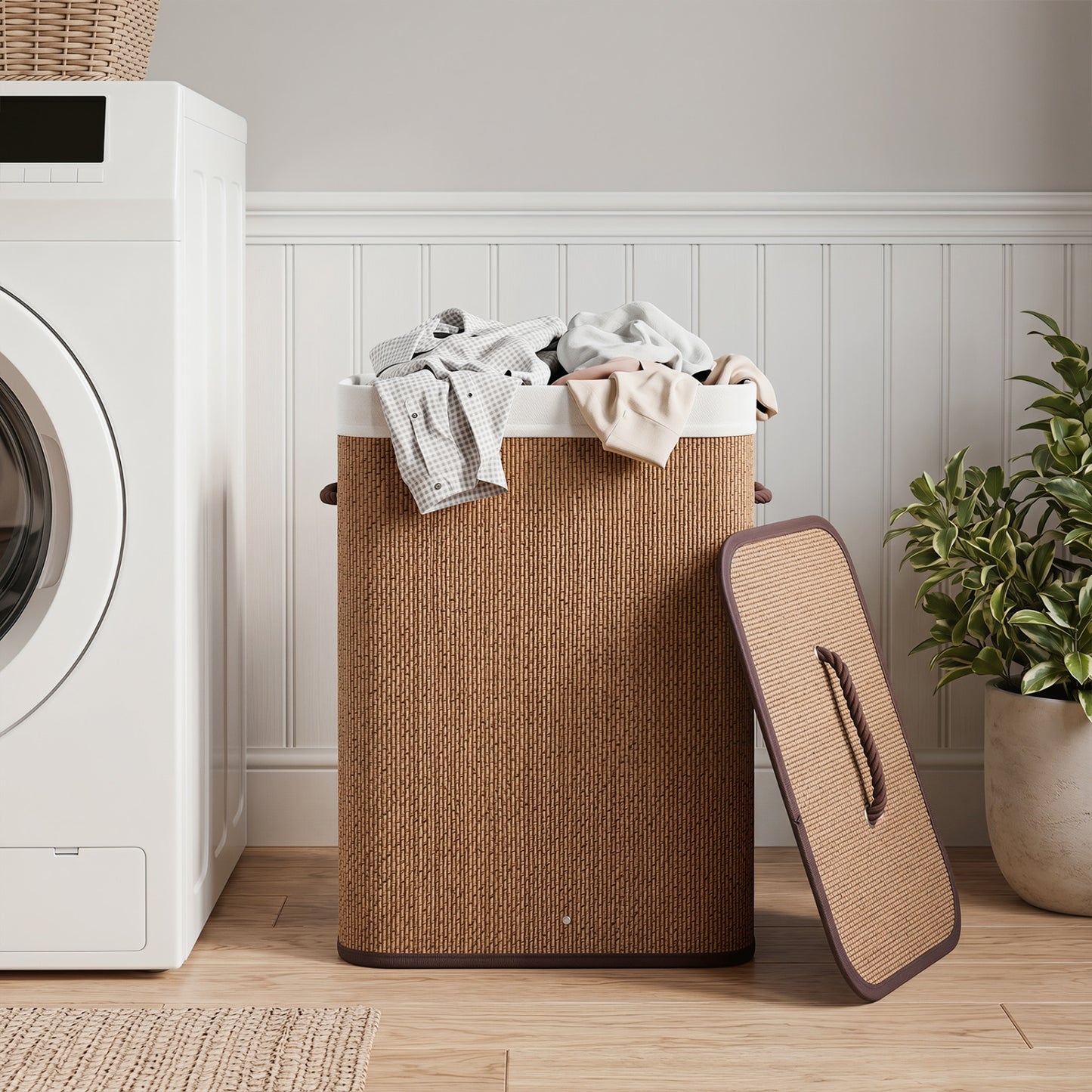 Black 19-gallon bamboo laundry hamper with removable liner and portable handles, suitable for bathroom or laundry room storage.