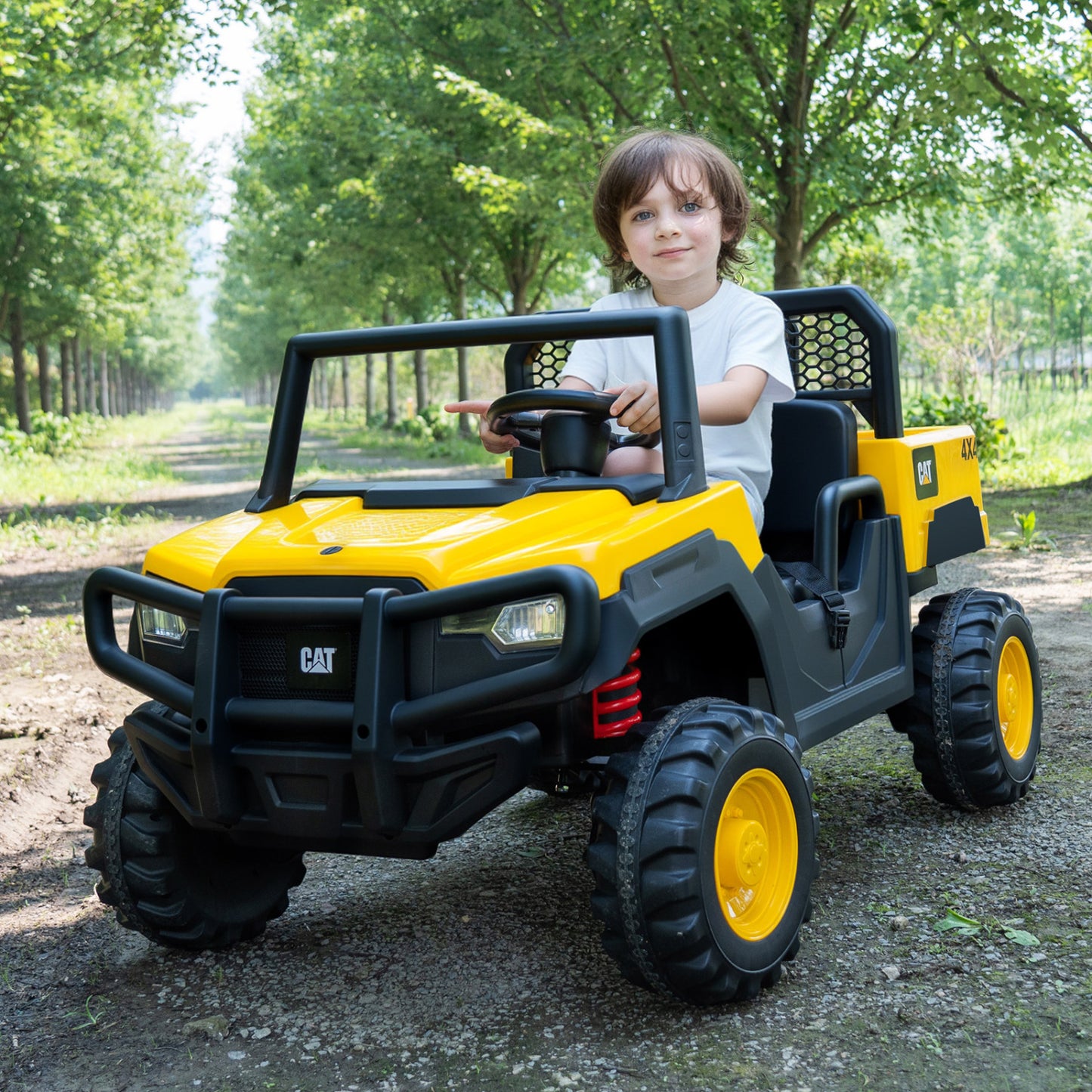 Yellow 24V Caterpillar ride-on dump truck for kids, two-seater toy from Wilsons Home Store, designed for outdoor play.