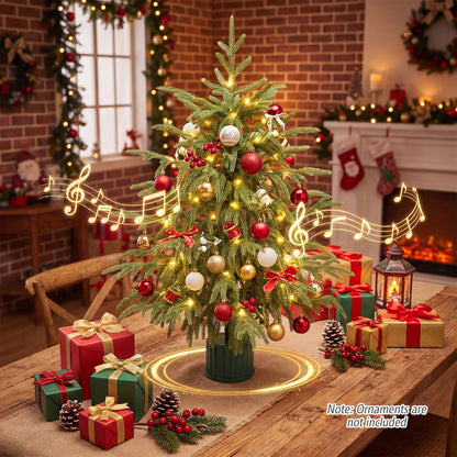 Set of two 24-inch pre-lit tabletop Christmas trees with rotating musical bases and PE branch tips, ideal holiday decorations.