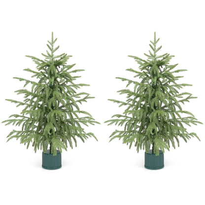 Set of 2 24-inch pre-lit tabletop Christmas trees with rotating musical bases and PE branch tips, festive holiday decor.