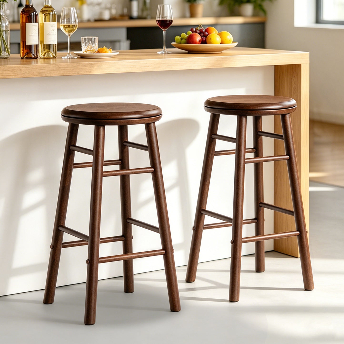 Set of two 24-inch gray swivel bar stools with footrests and crossbars, ideal for kitchen and dining area seating.