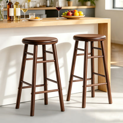 Set of two 24-inch gray swivel bar stools with footrests and crossbars, ideal for kitchen and dining area seating.