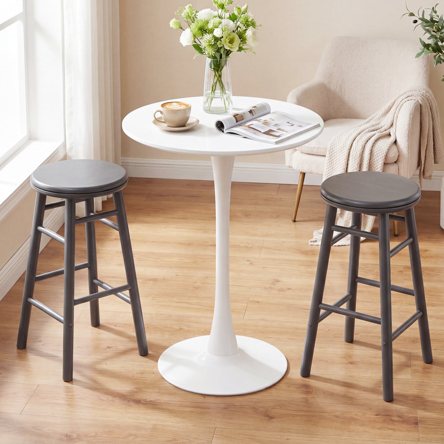 Pair of 24-inch gray swivel bar stools with footrests and crossbars, featuring modern design for kitchen and dining areas.