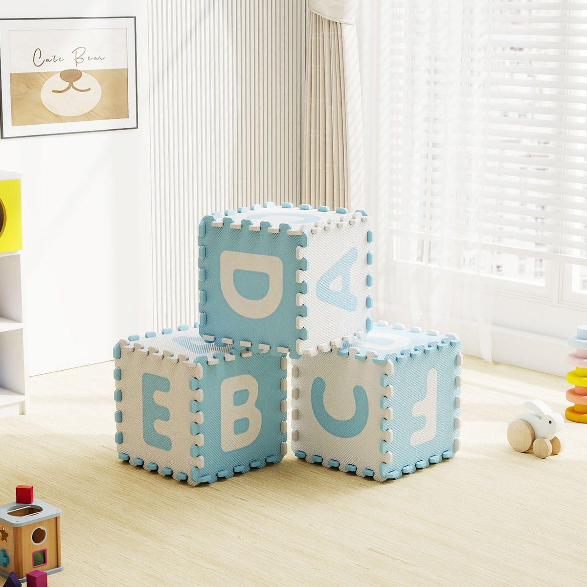Colorful 26-piece interlocking ABC play mats with detachable letters, blue baby gym and play area for kids.