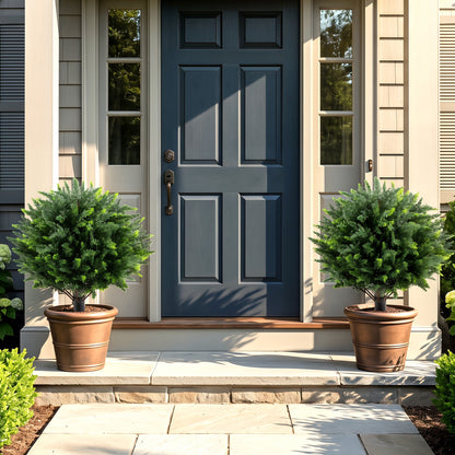 Set of two 27.5-inch artificial cypress topiary trees with ground spikes, ideal for home décor and faux plant displays.