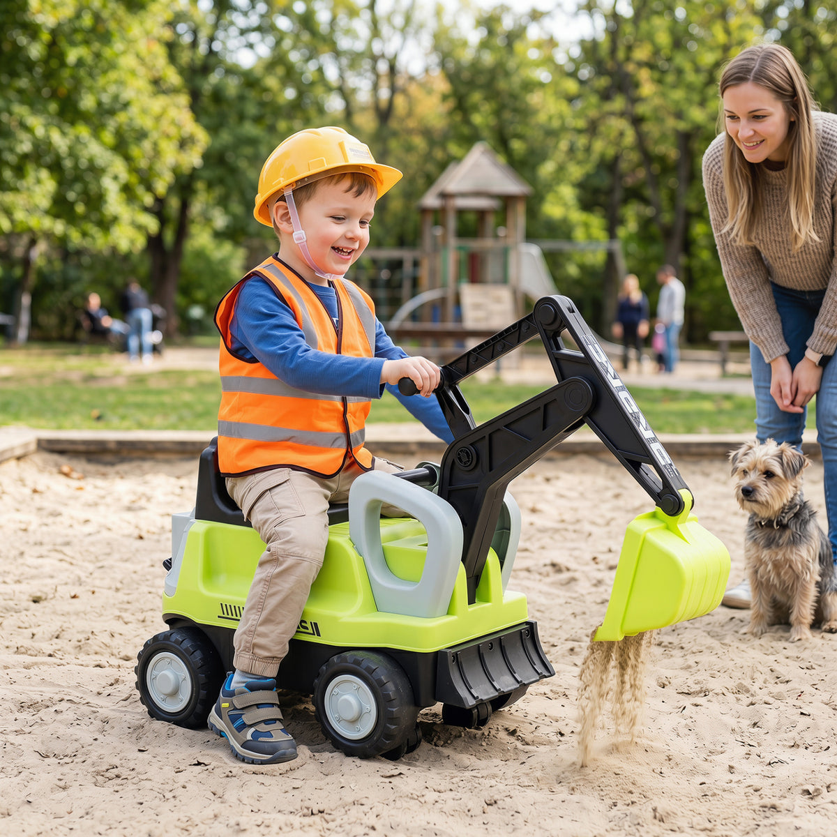 Green 2-in-1 kids ride-on tractor with digging arm and detachable trailer, suitable for outdoor play and imaginative fun.