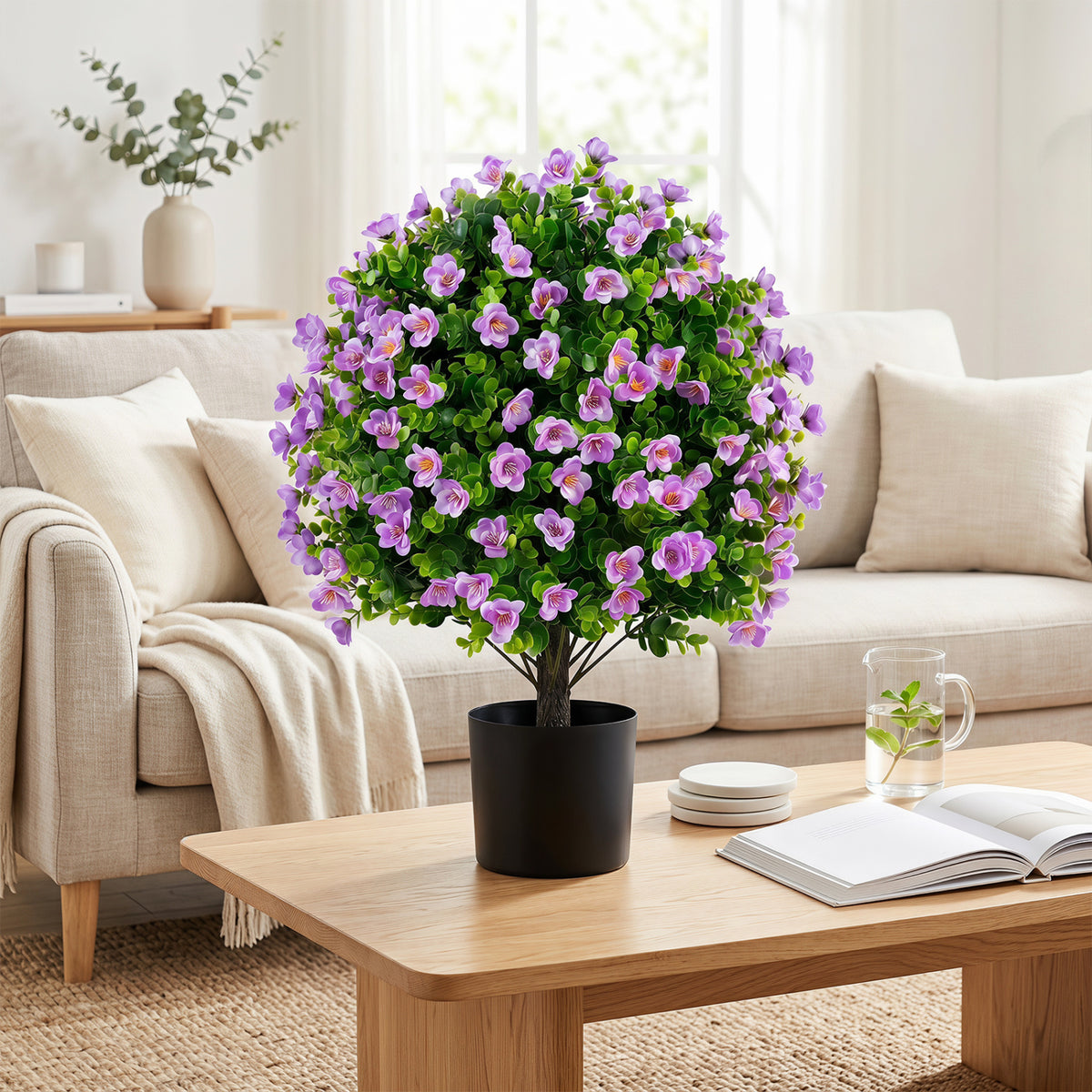 Two artificial eucalyptus topiary trees with purple flowers in cement planters, perfect for home decor, by Wilsons Home Store.