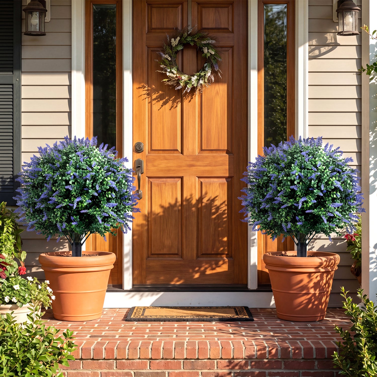Two artificial lavender boxwood topiary ball trees with ground spikes, decorative faux plants for home or garden decor.