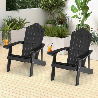 Two black outdoor Adirondack chairs with ergonomic design, perfect for porch or backyard seating, by Wilsons Home Store.