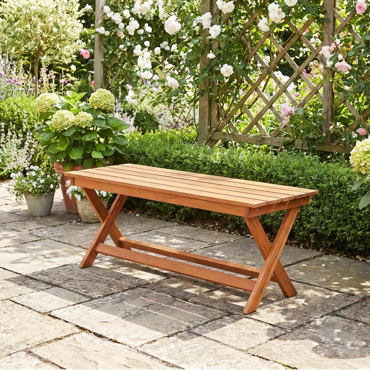 Pair of wooden garden patio benches with X-shaped legs, outdoor seating set from Wilsons Home Store for patio or garden use.