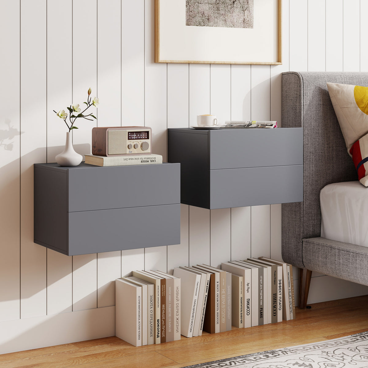 Black wall-mounted floating nightstand with two storage drawers, ideal for bedroom organization and modern bedroom decor.
