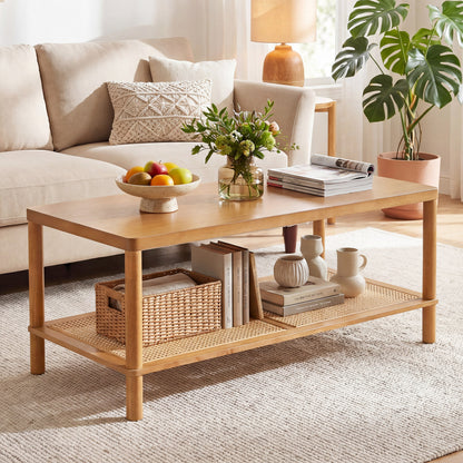 Black 2-tier boho coffee table with rubber wood frame and PVC rattan shelf for living room, rectangular center table.