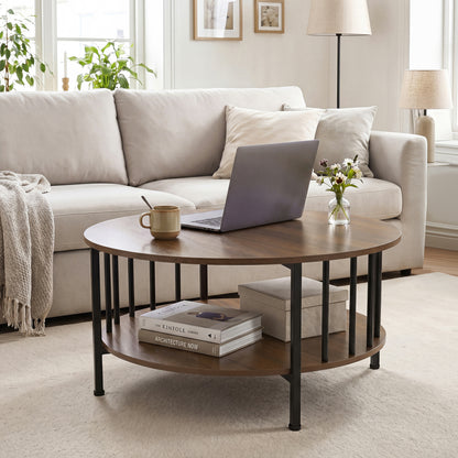 Round black walnut coffee table with two tiers and metal accents, featuring a built-in storage shelf for living room decor.