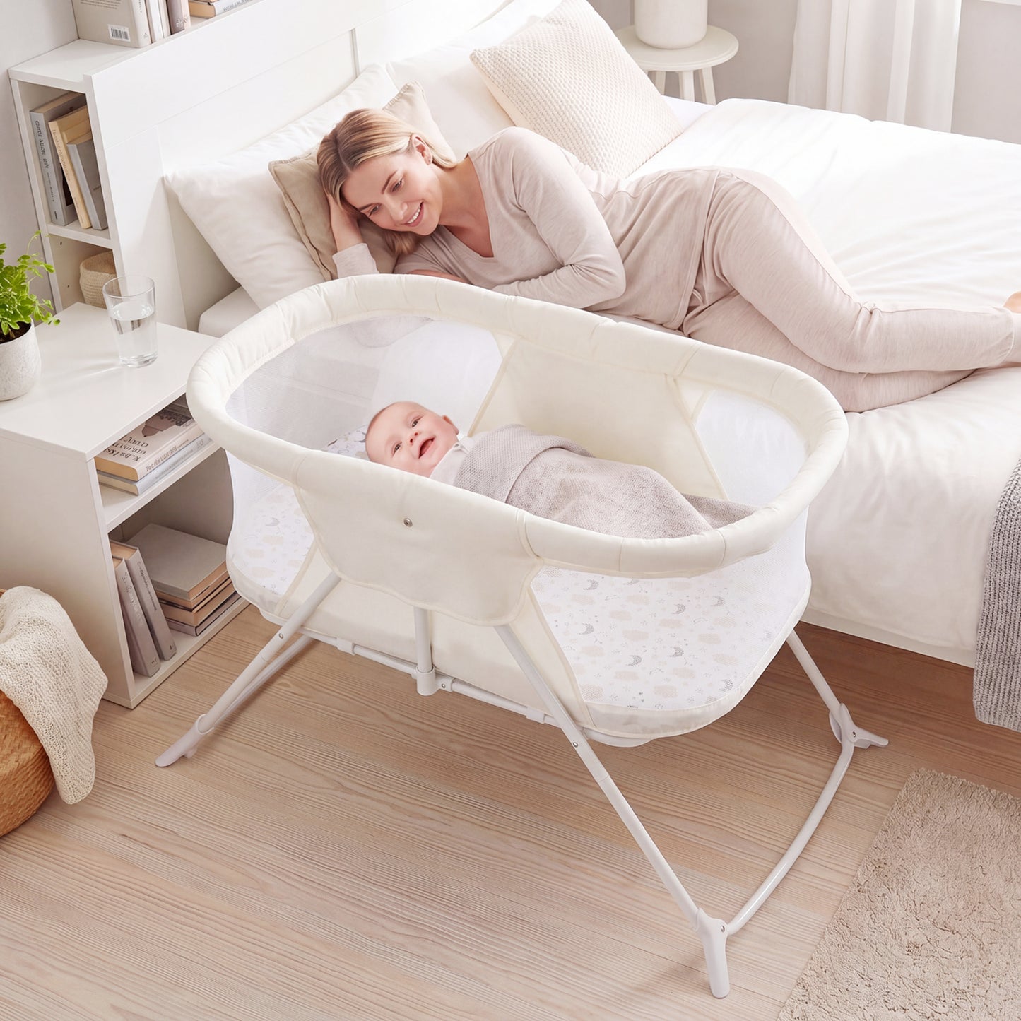 Beige 2-in-1 baby bassinet with rocking motion and breathable mesh, foldable bedside sleeper for nursery comfort.