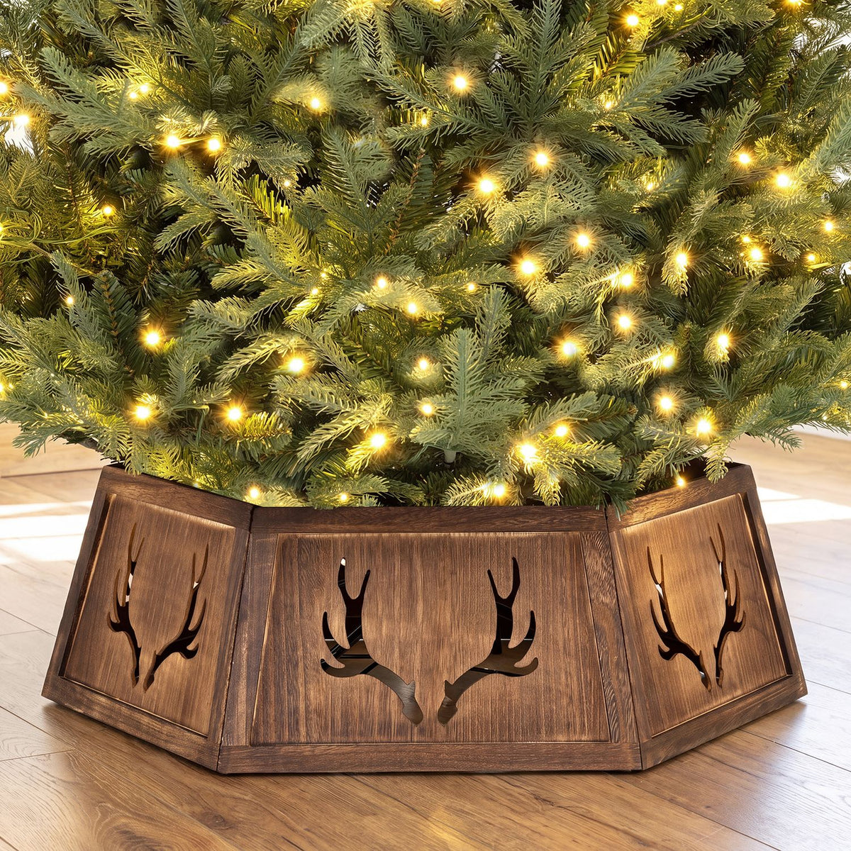 Decorative 31.5-inch Christmas tree collar with antler design for 6-9 ft artificial trees, easy tool-free setup by Wilsons Home Store.