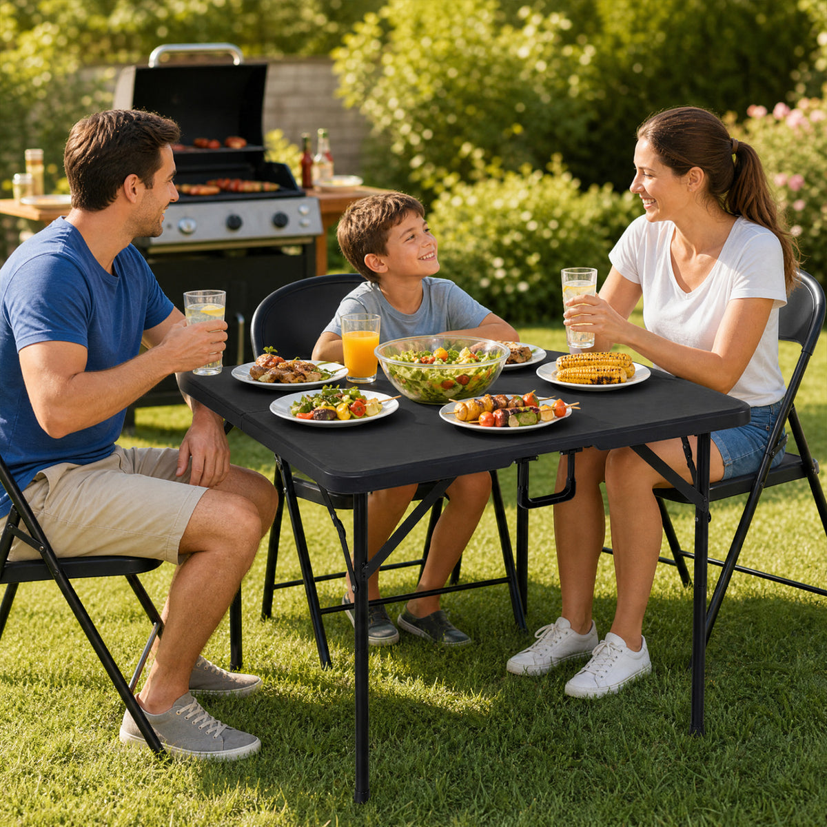 Black 34-inch square foldable card table with carrying handle, outdoor patio table for picnics and outdoor gatherings.