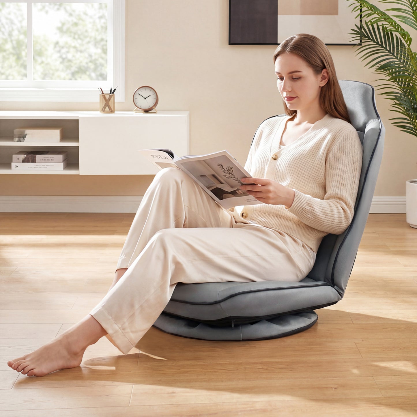 Beige 360° swivel floor gaming chair with adjustable backrest and modern design, ideal for home office gaming setups.