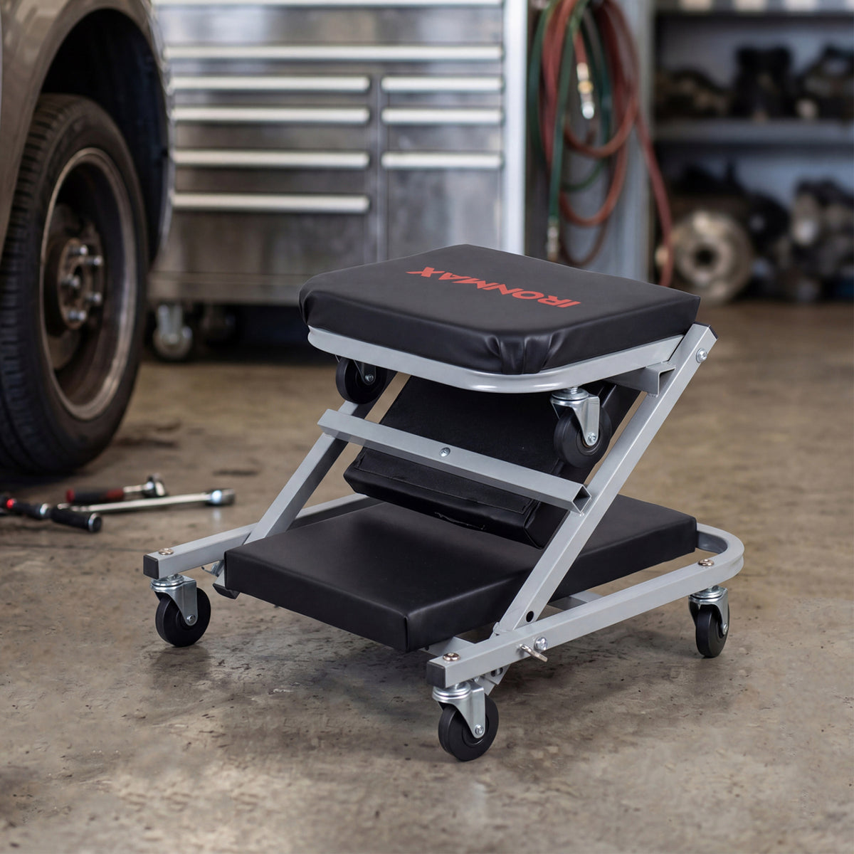 Black 36-inch 2-in-1 mechanic creeper and Z-seat with six swivel casters, ideal for garage and outdoor storage use.