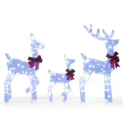 Three white lighted Christmas reindeer figures forming a family set for outdoor yard decoration, perfect for holiday festive display.