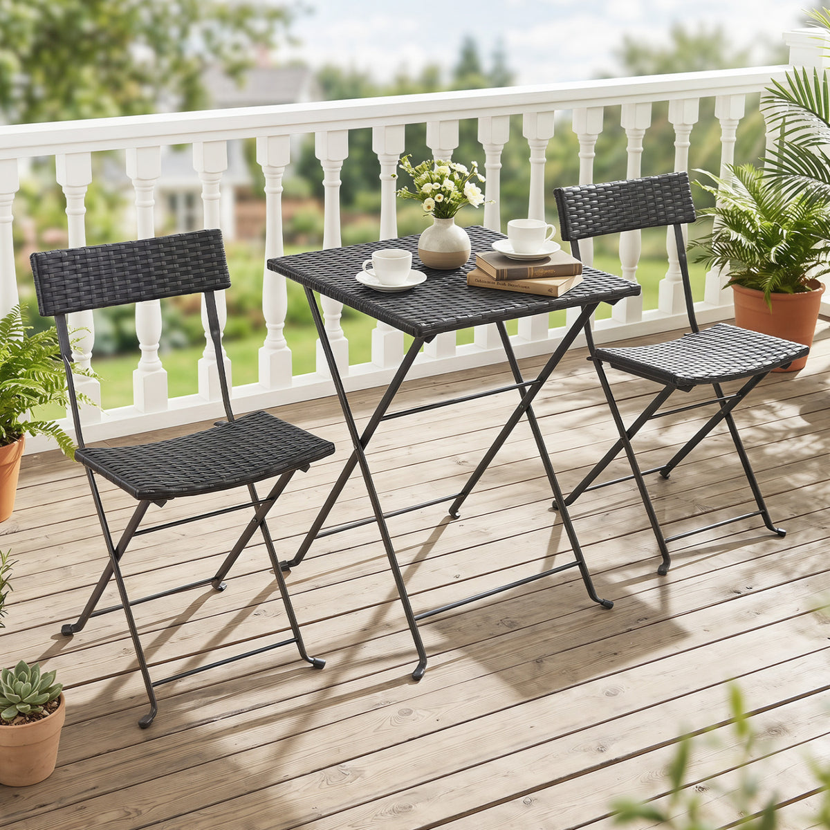 Black 3-piece folding bistro set with PE wicker chairs and X-shaped metal frame for outdoor patio dining.