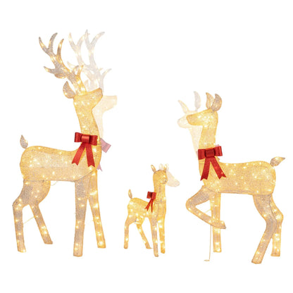 Three lighted golden Christmas reindeer figures forming a family set, holiday holiday decor for festive Christmas display.