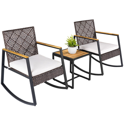 Beige 3-piece wicker rocking chair set with cushions and coffee table for outdoor porch seating, by Wilsons Home Store.