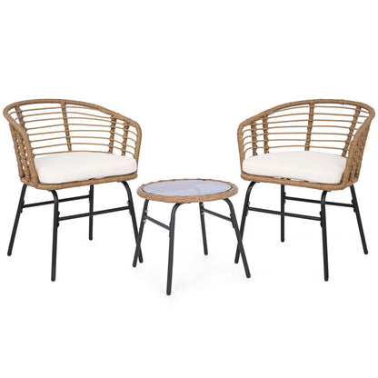 Three-piece outdoor patio furniture set with white cushions, including chairs and a table, by Wilsons Home Store.