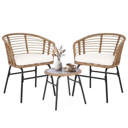 Three-piece outdoor patio furniture set with white cushions, including chairs and a table, by Wilsons Home Store.