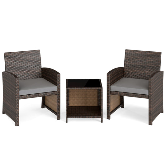 Three-piece brown outdoor patio furniture set with soft cushions and tempered glass coffee table for outdoor conversation areas.