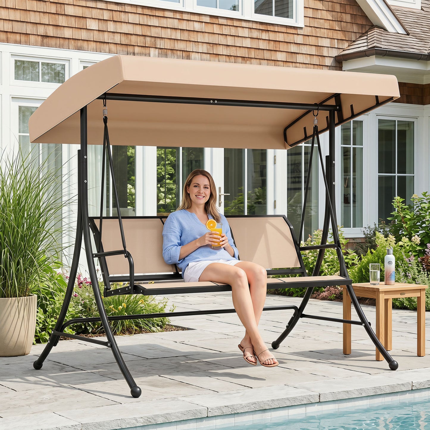 Beige 3-seat patio swing chair with adjustable canopy, outdoor porch swing from Wilsons Home Store, perfect for relaxing outdoors.