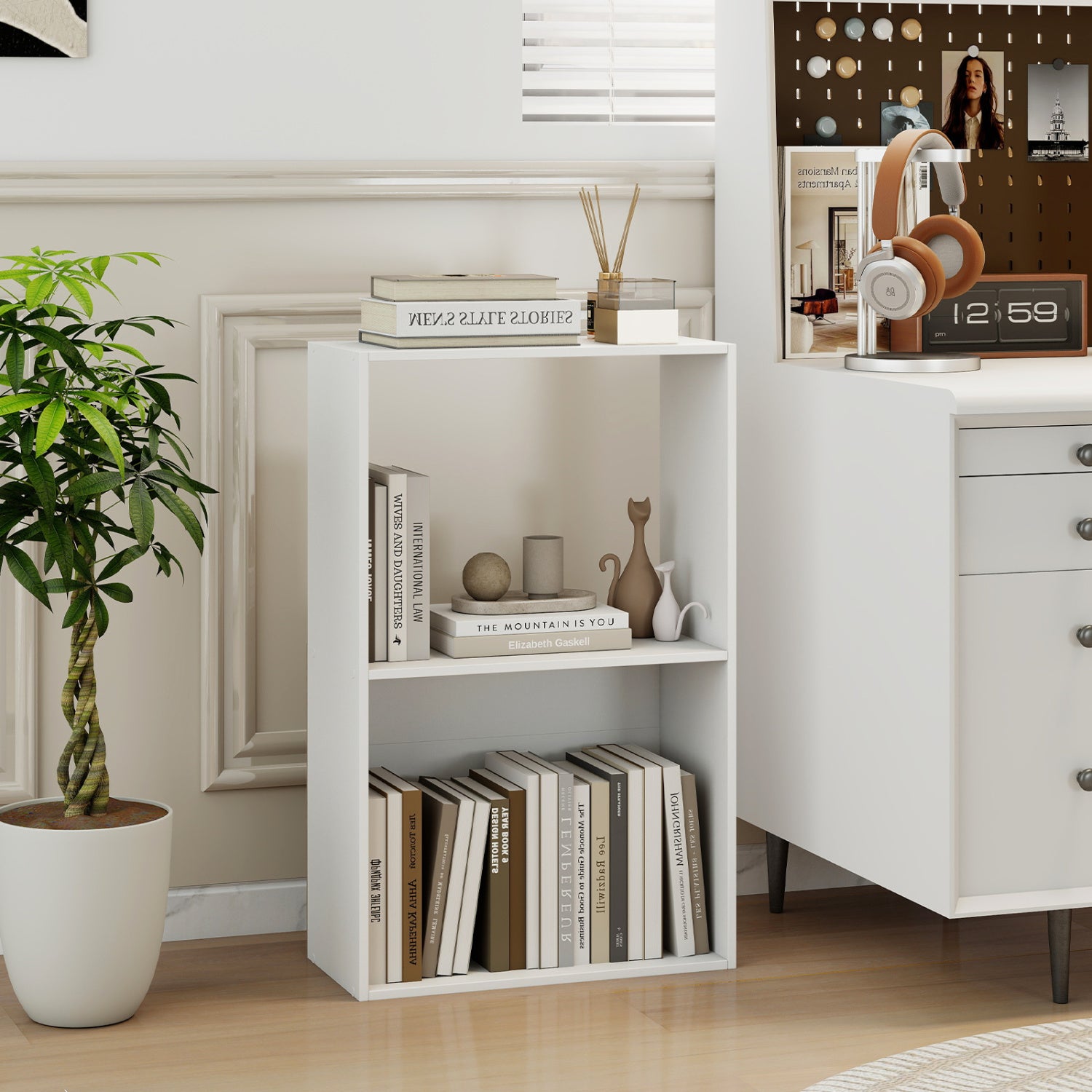 Black 3-tier bookshelf with open storage compartment and display shelf, ideal for home office organization and book display.